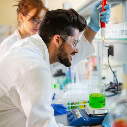 Group of medical research scientists collectively working in laboratory