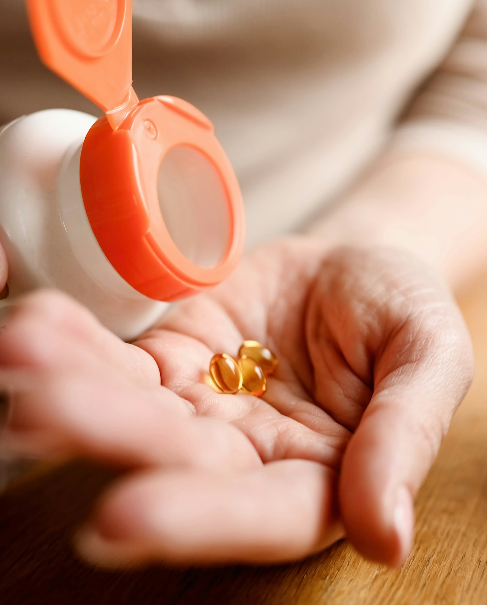 Girl take pills with dietary supplement and vitamins.